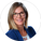 A professional portrait of Katherine Rentsch, BSc. (Eng) '01, a woman with shoulder-length blonde hair, wearing glasses, a blue blazer, and a white blouse with a floral pattern, smiling against a white background.